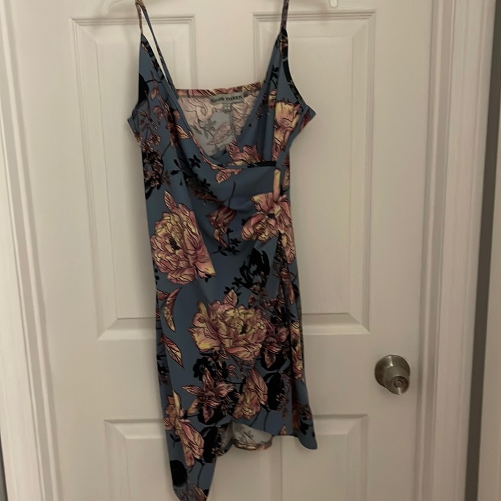 Size large tight fitting flowered dress. Great condition.